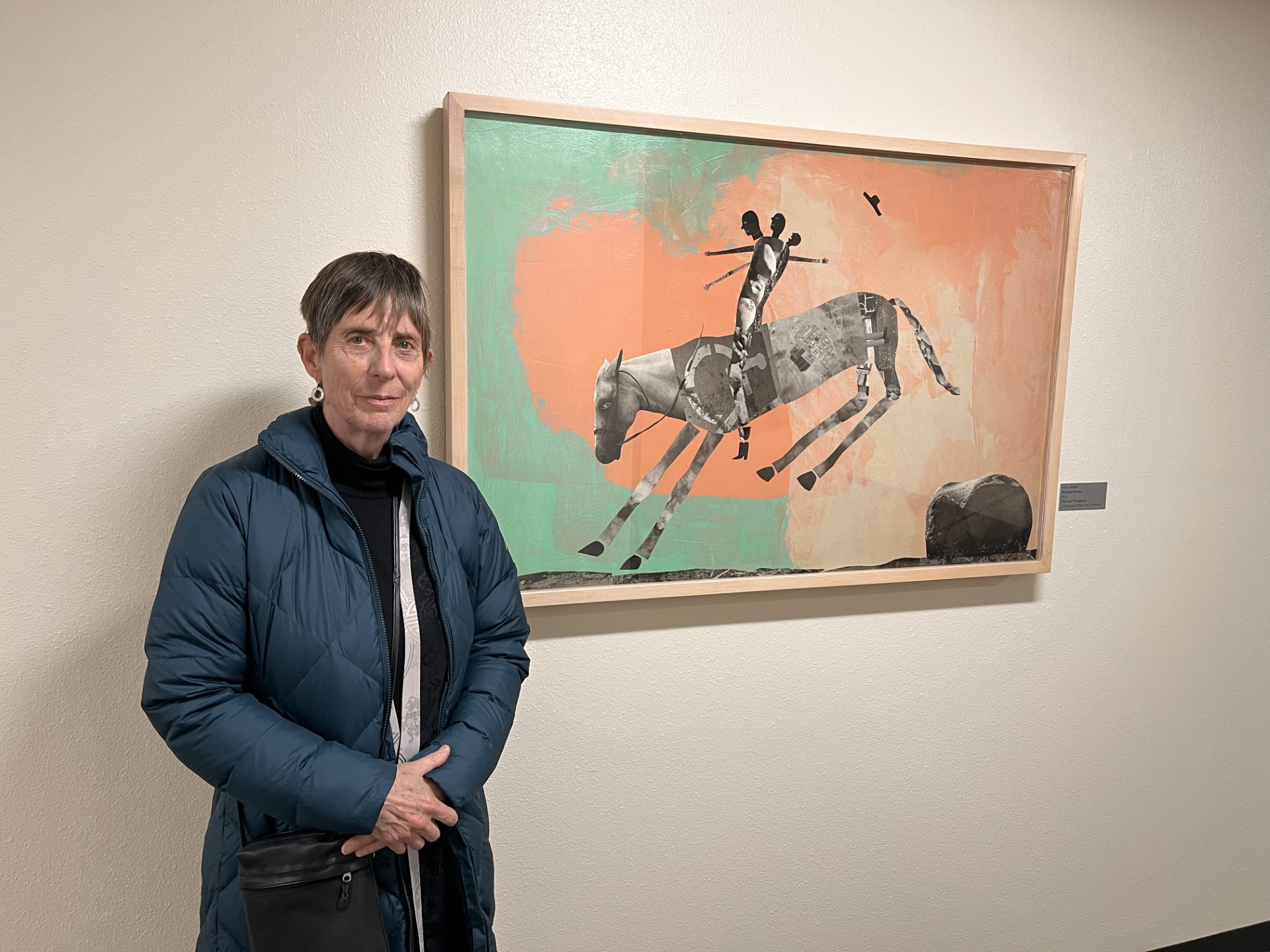 Artist Holly Roberts standing with her work, Bucking Bronco